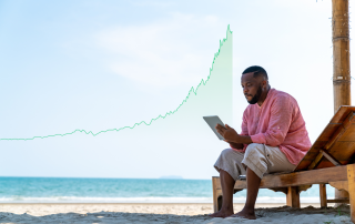 Man looks at his earnings via a stock analysis tool while relaxing on the beach.